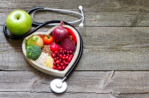 48070183 - healthy food in heart and cholesterol diet concept on vintage boards