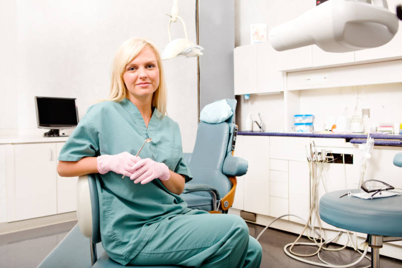 A portrait of a female dentist in a clinic